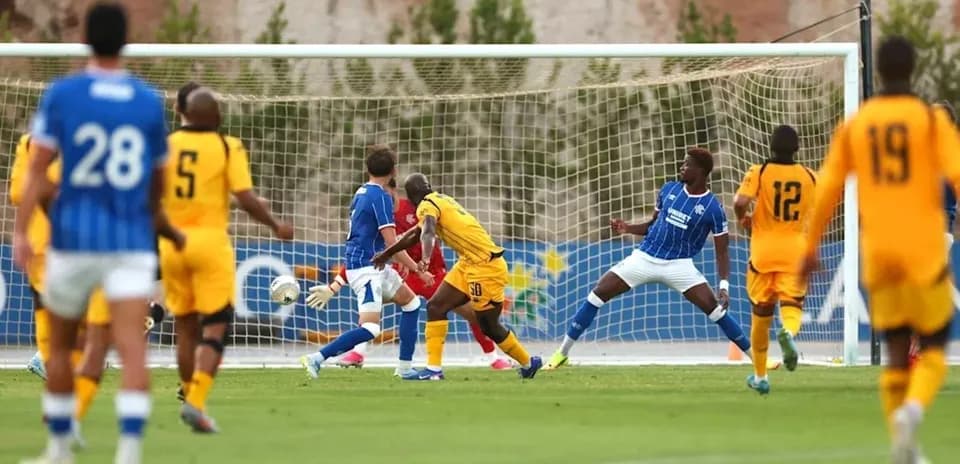 Players in action near the goal during match