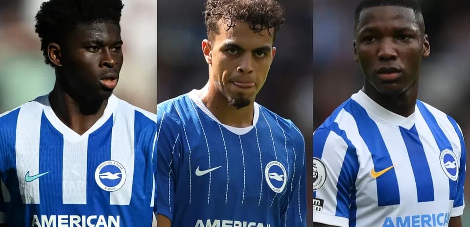Three Brighton players in blue and white jerseys