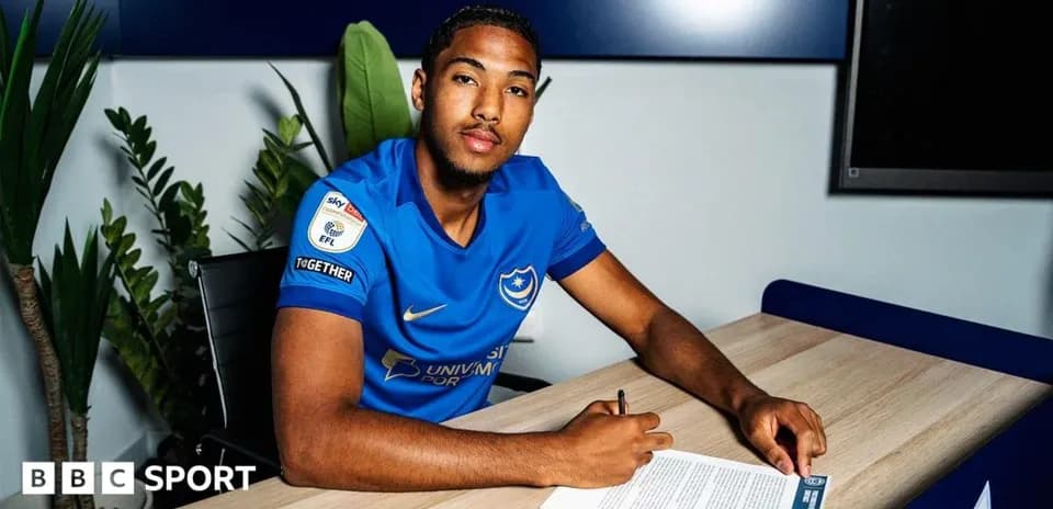 Player signing contract at Portsmouth office