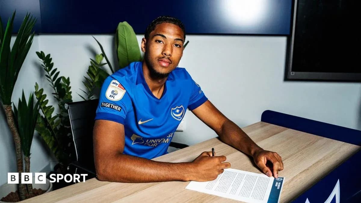 Player signing contract at Portsmouth office