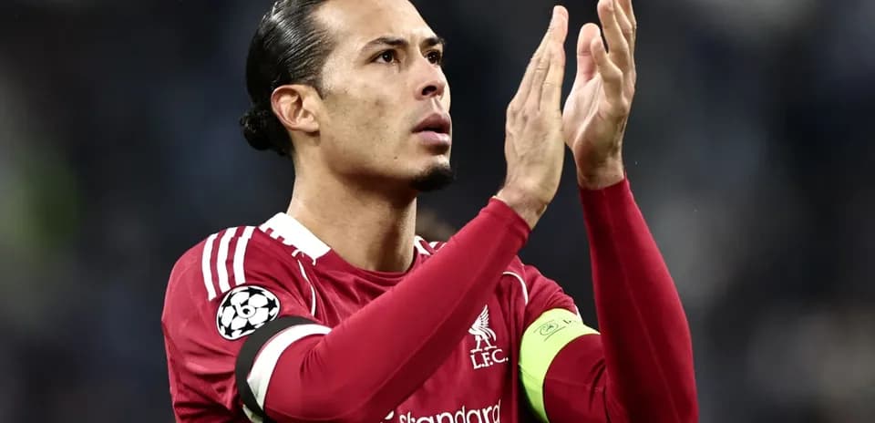 Player applauding fans in Liverpool jersey
