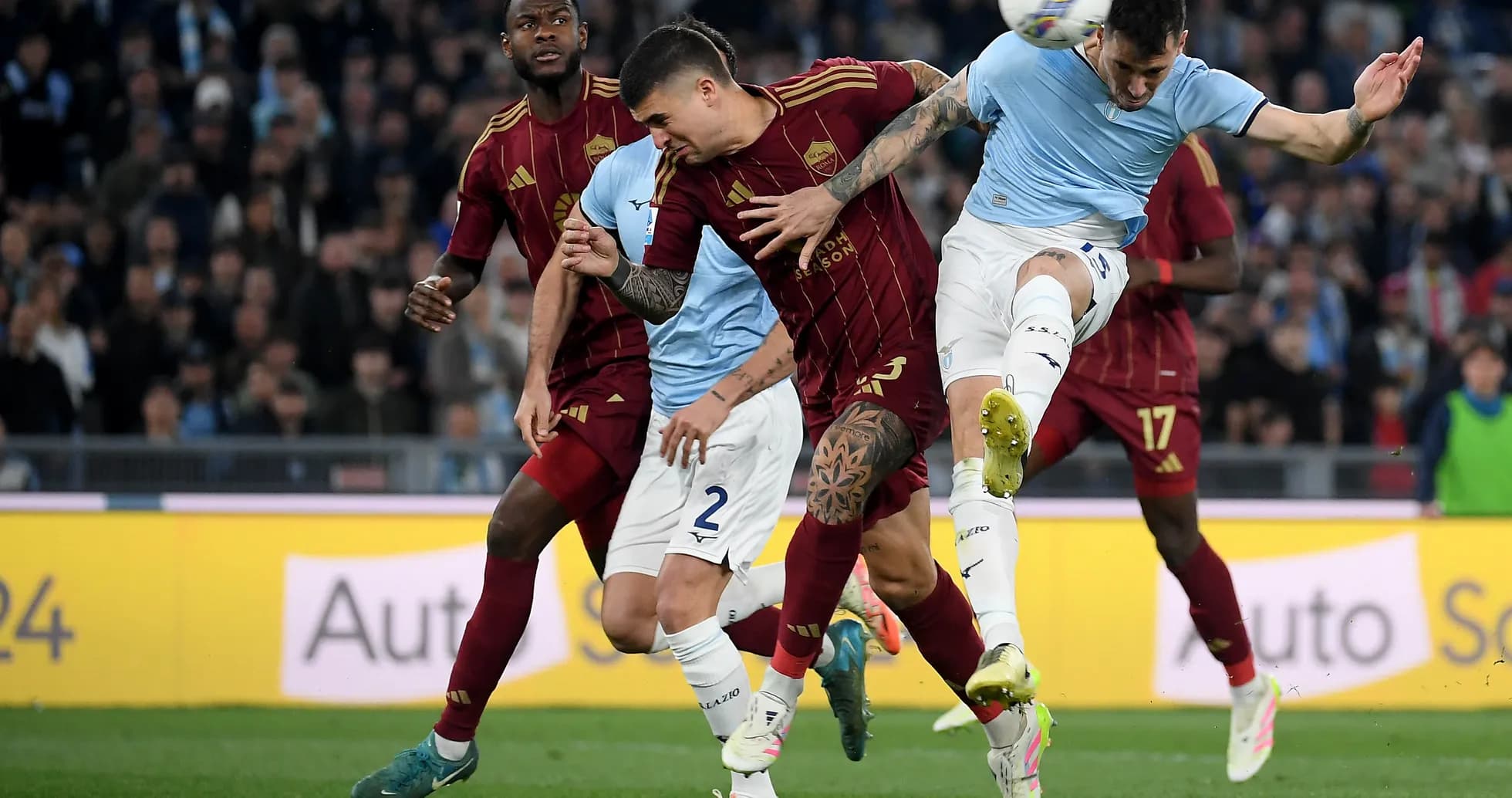 AS Roma and Lazio players in intense match action