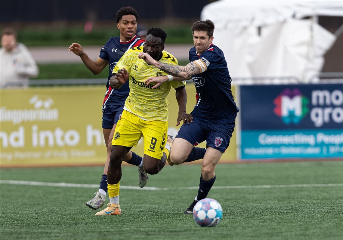 Player battling for the ball during match