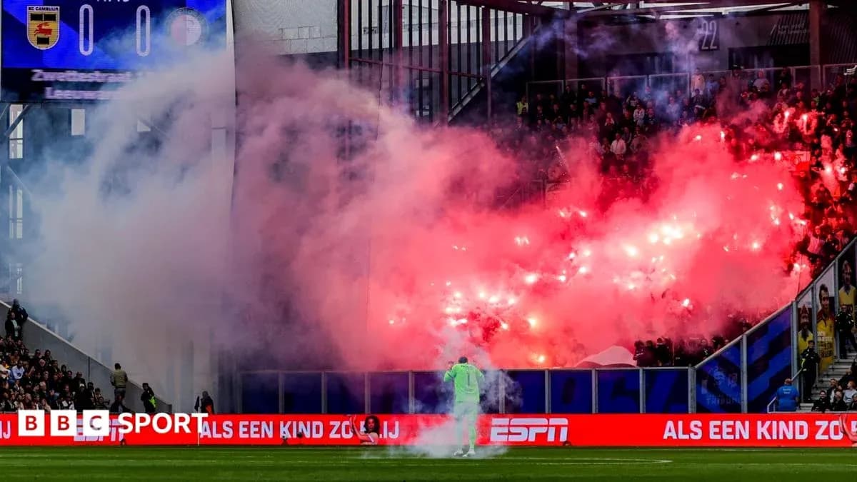 Fans creating smoke with flares during match