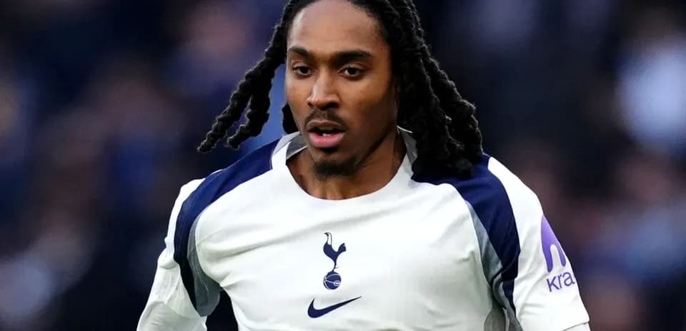 Player in Tottenham kit running during match