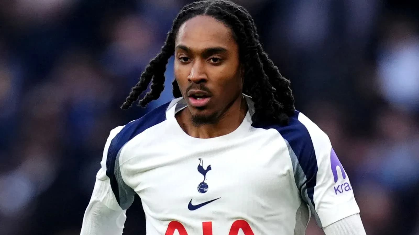 Player in Tottenham kit running during match