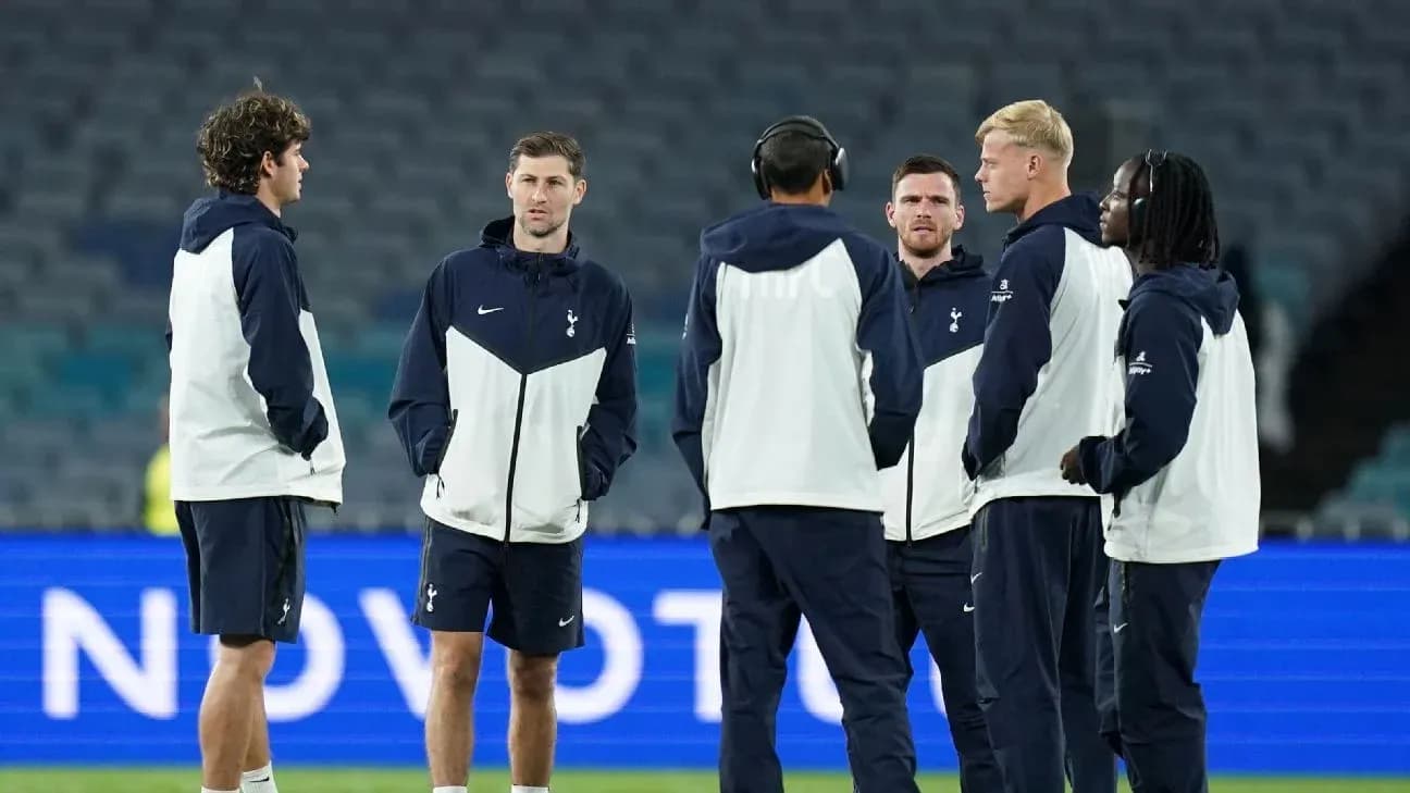 Tottenham players discussing on the pitch pre-match