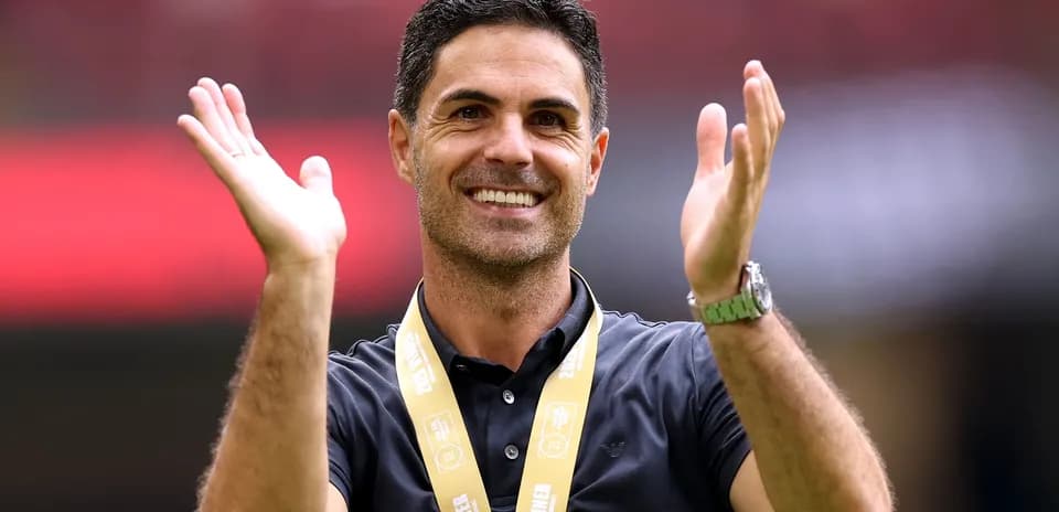 Coach celebrating with a medal at event