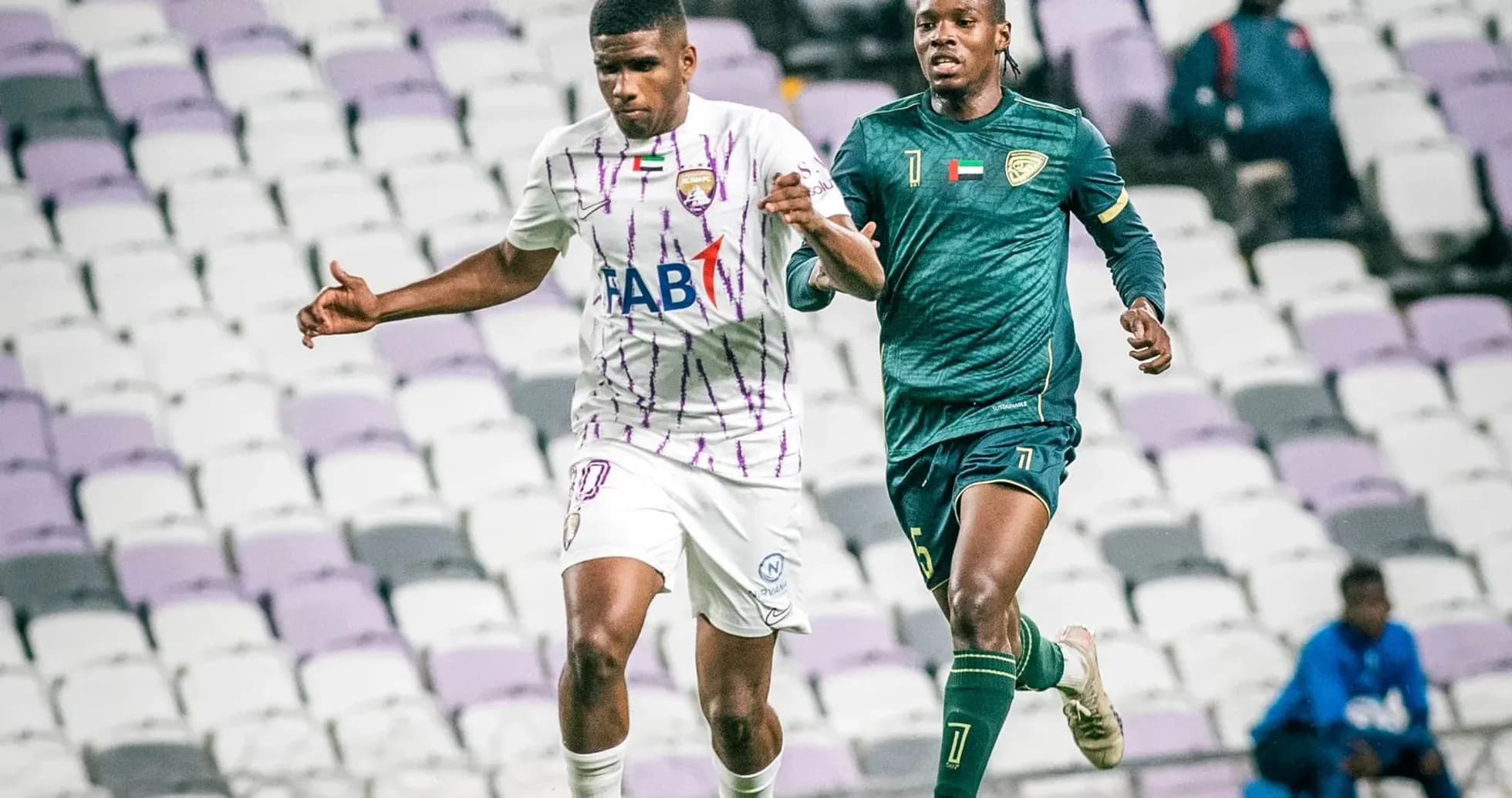 Al Bataeh U23 player dribbling past Khorfakkan U23 goalkeeper