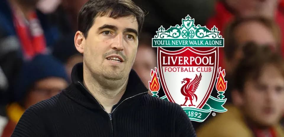 Man in black sweater with Liverpool logo background