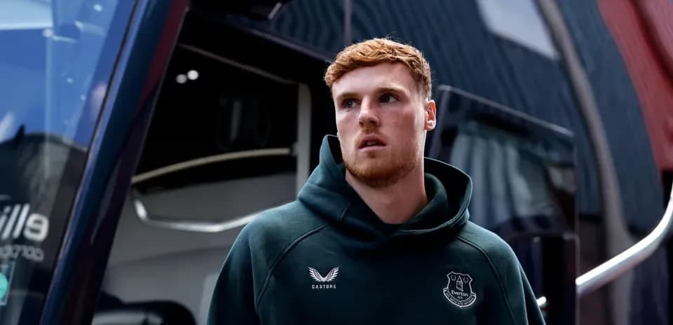 Everton player outside team bus before match