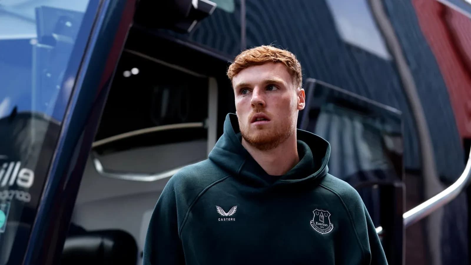 Everton player outside team bus before match