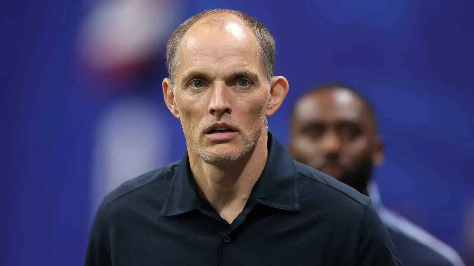 Coach standing on the sidelines during match