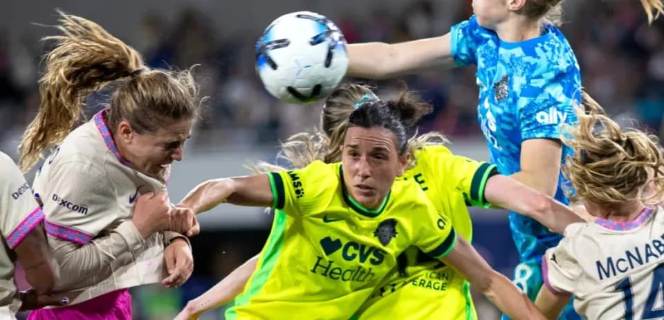 Goalkeeper catching the ball during match action
