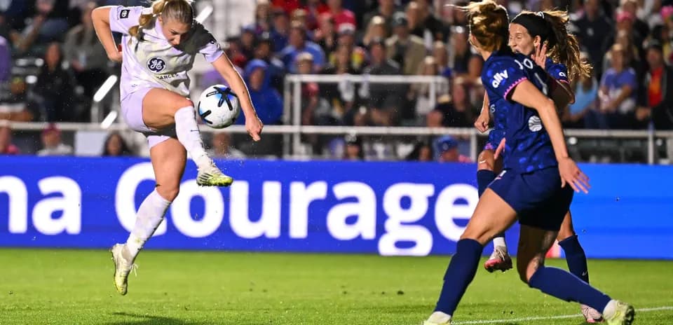 Player striking ball during NWSL match
