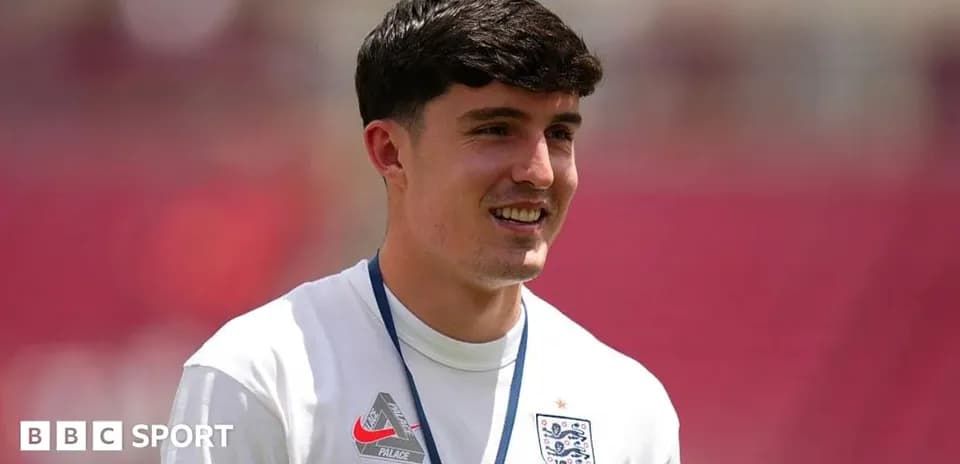Player in England training kit smiling during session