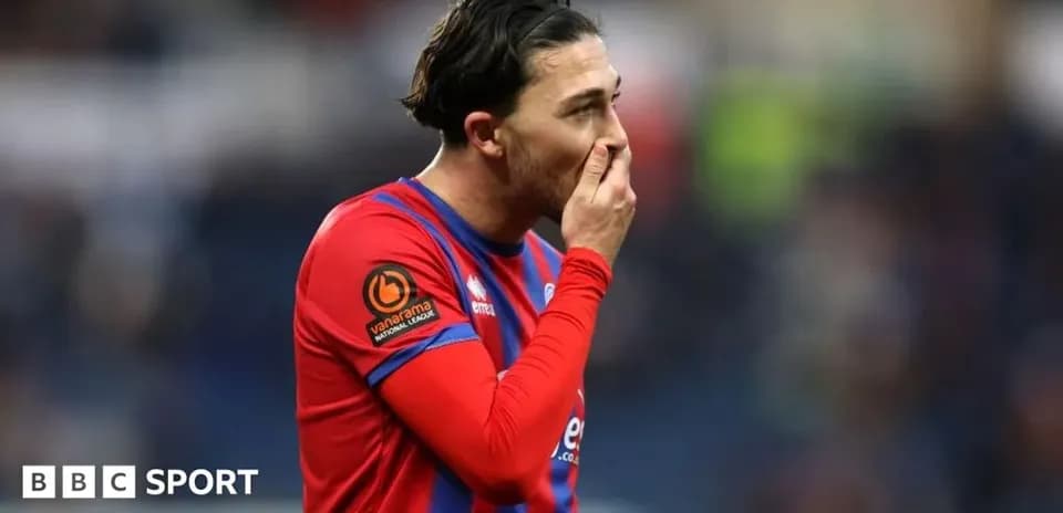 Player in red and blue kit during match