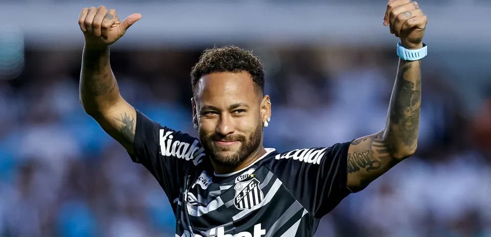 Player celebrating in Santos FC jersey with thumbs up