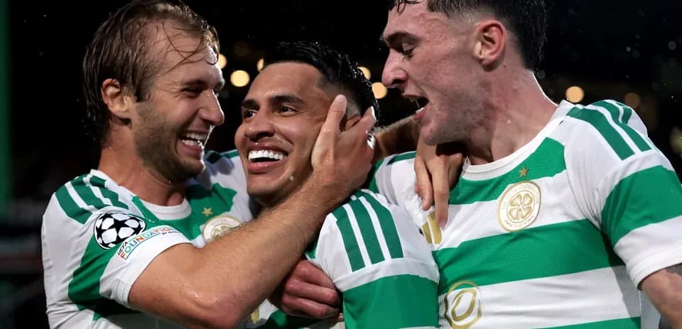 Celtic players celebrating a goal during match