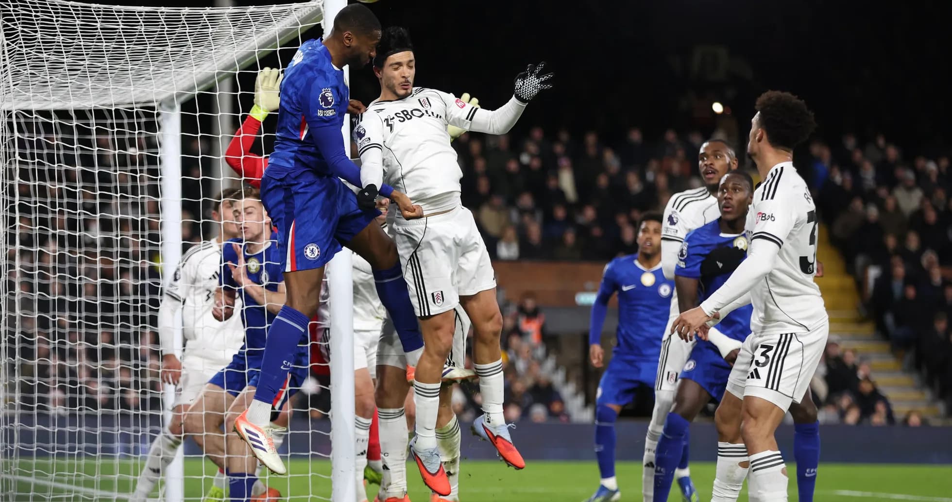 Players contesting a corner during Fulham vs Chelsea
