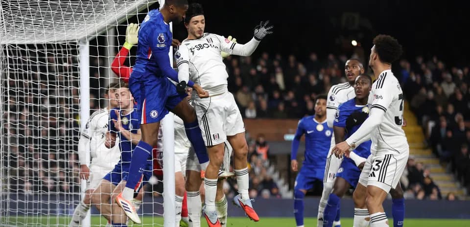 Players contesting a corner during Fulham vs Chelsea