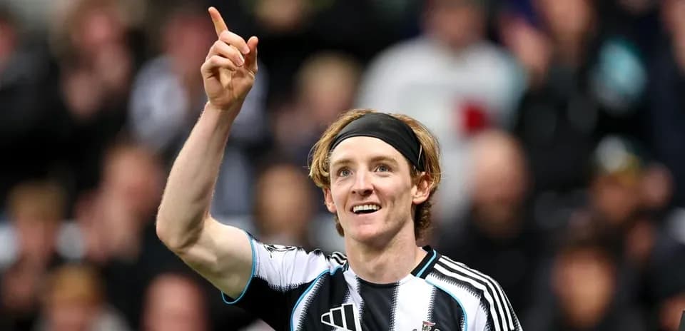 Newcastle player celebrating with raised finger