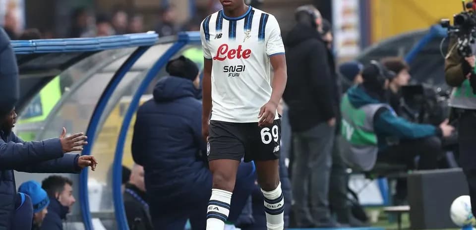 Player walking off the pitch towards the bench