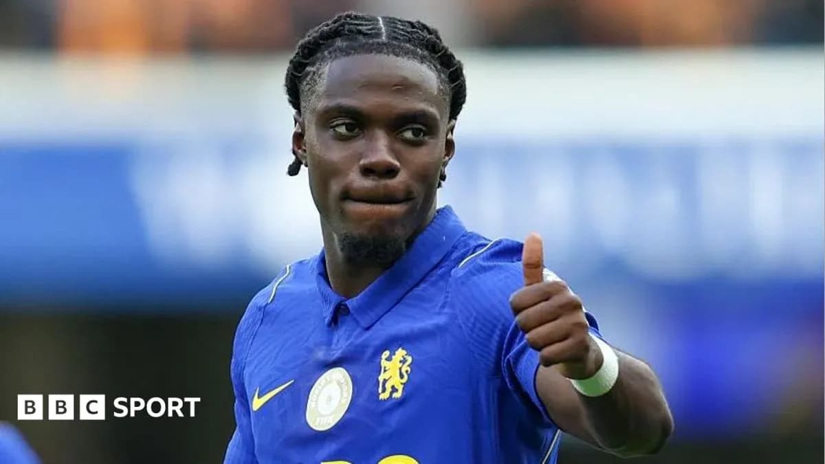 Player in blue jersey giving a thumbs up