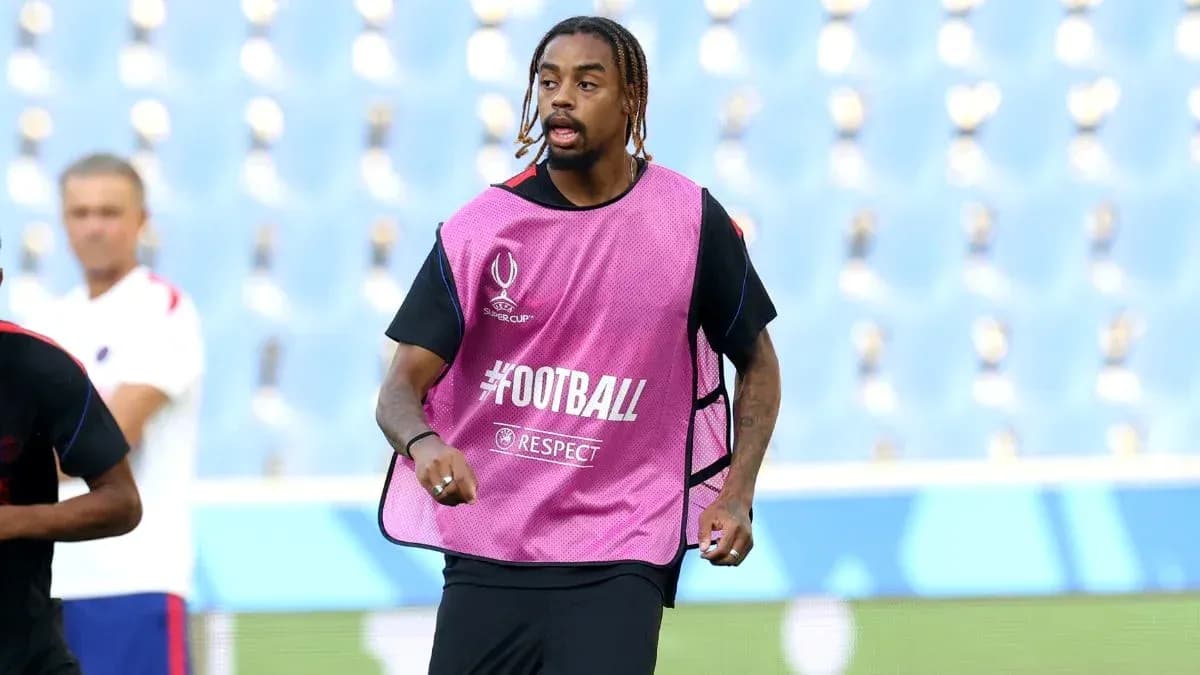 Player training in pink bib during warm-up session