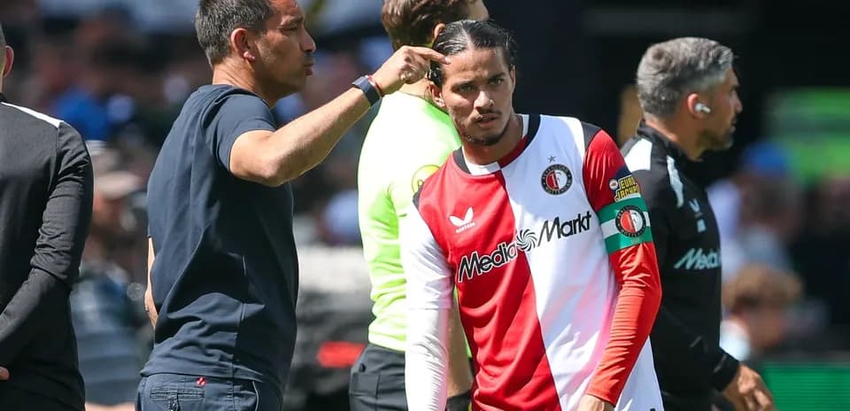 Coach giving instructions to player before substitution