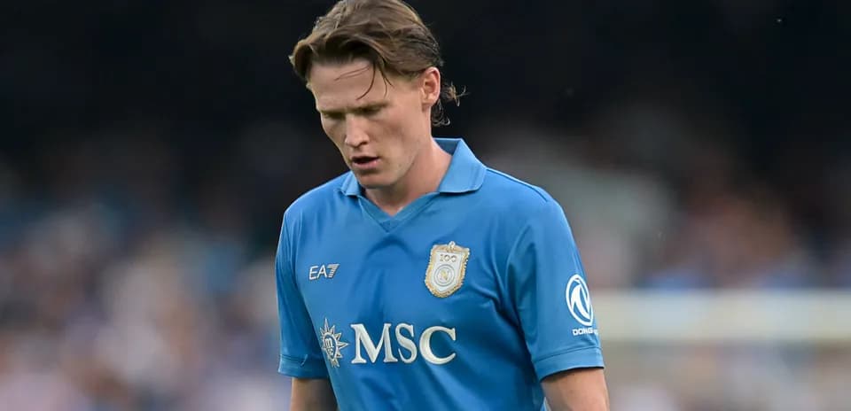 Player in blue jersey walking on the field