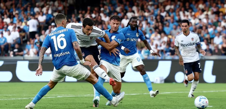 Players contesting for the ball in Serie A match