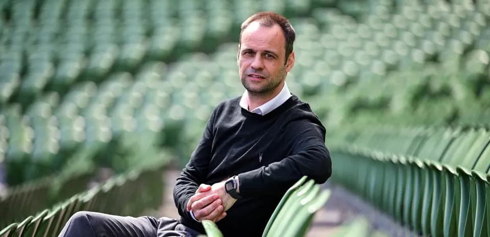 Person sitting on empty stadium seats