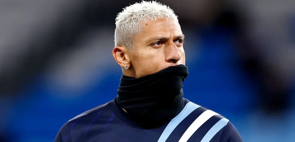 Player wearing a scarf during pre-match warm-up