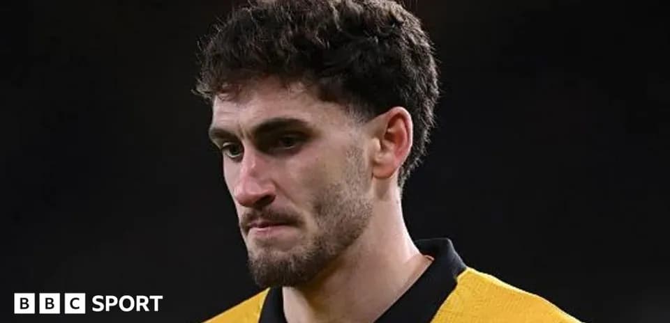Player in yellow jersey during post-match moment