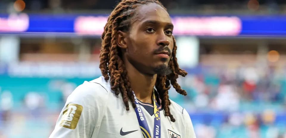 Player wearing England jersey walking off the pitch