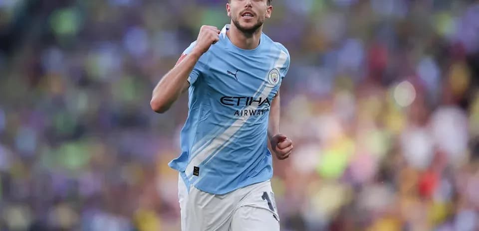 Player celebrating during match in light blue kit