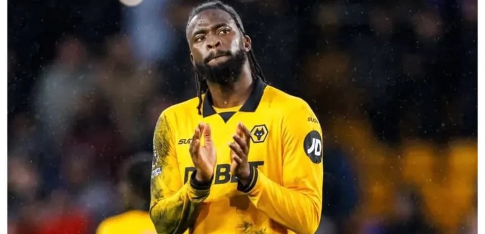 Player applauding fans in Wolves yellow kit