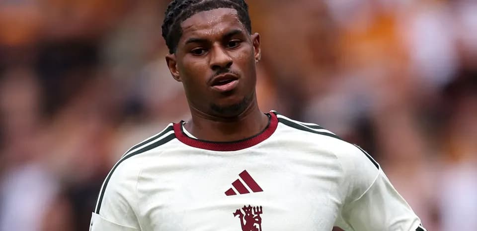 Player in white jersey during football match