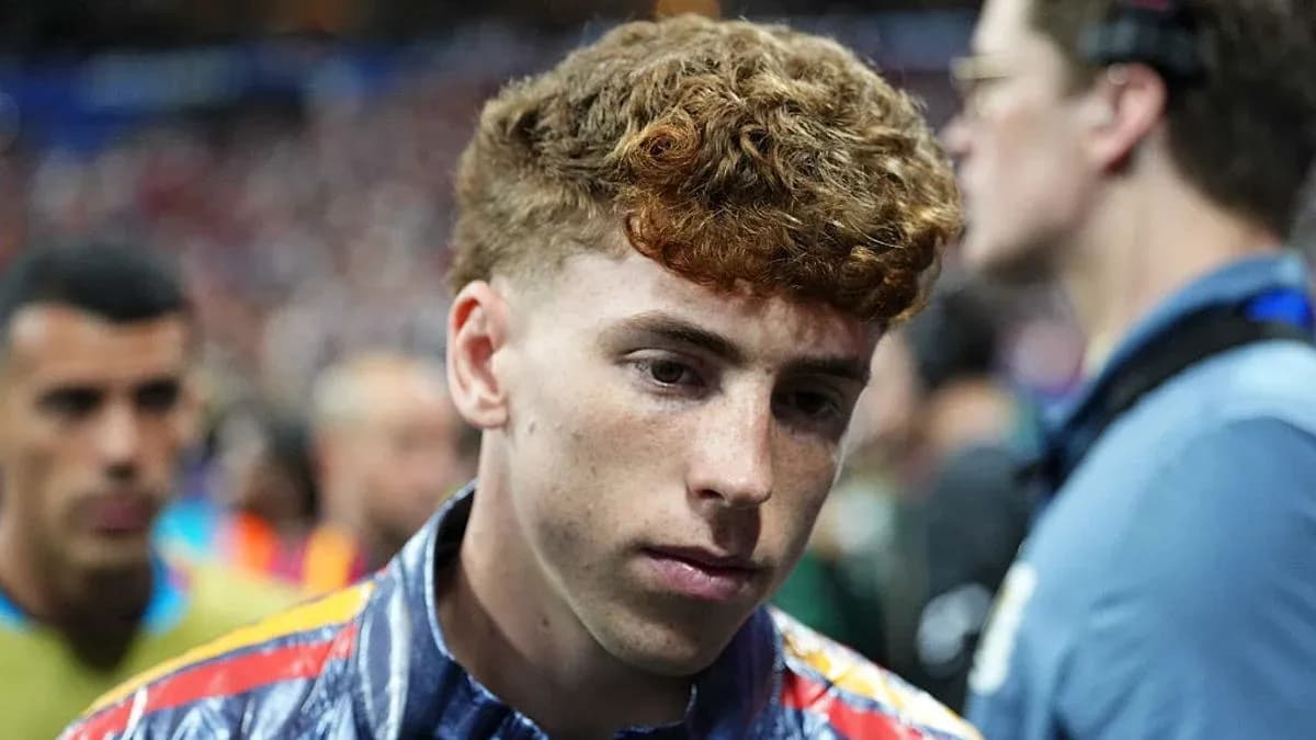 Young player walking off the pitch after match