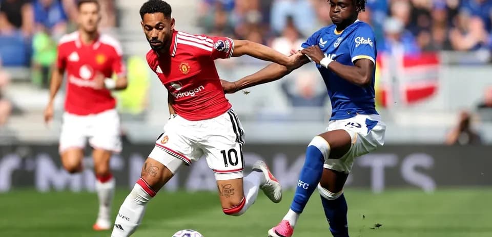 Player dribbling while being challenged by opponent