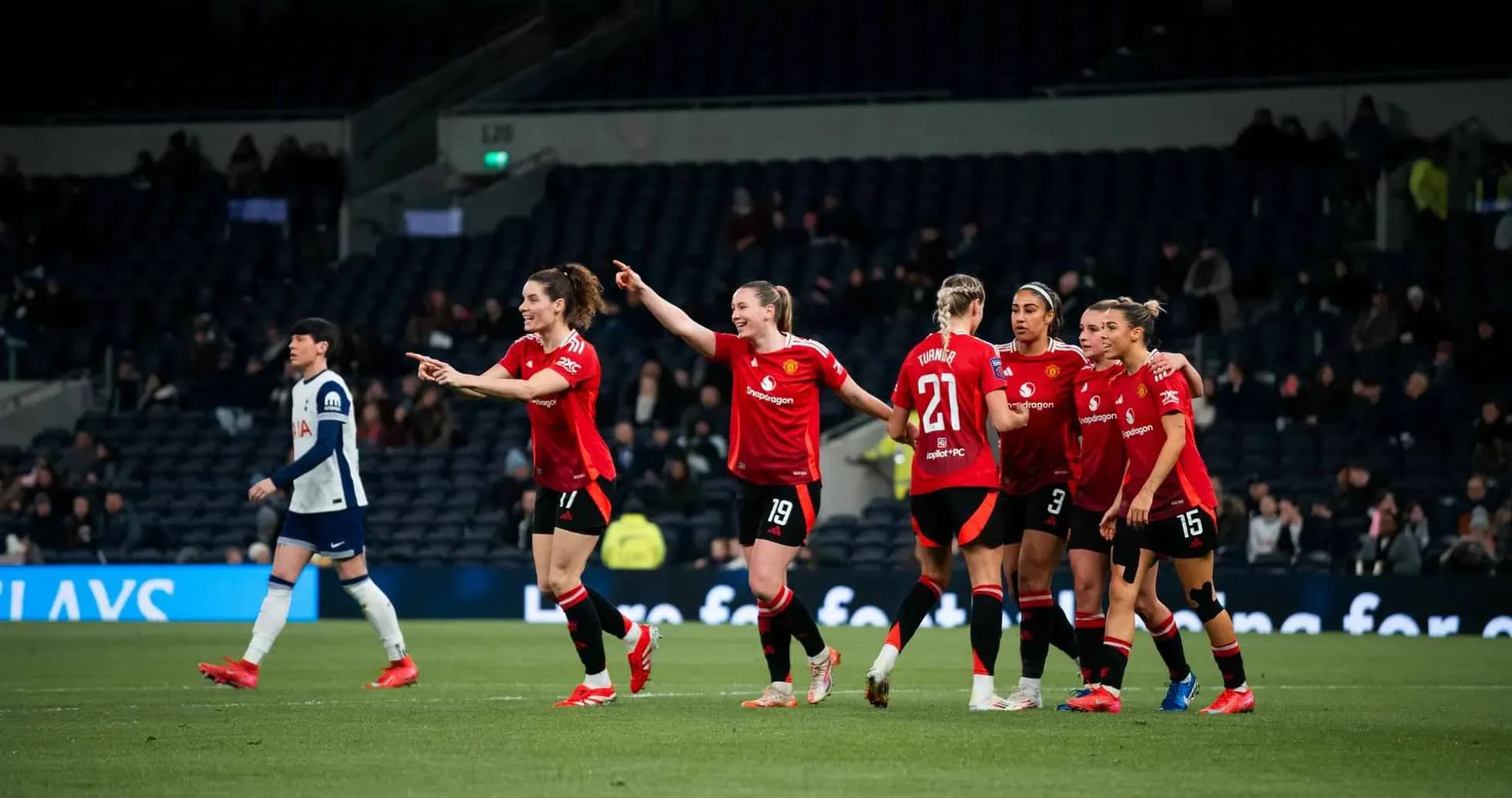 Manchester United W celebrating a goal against Tottenham Hotspur W
