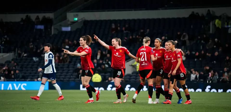 Manchester United W celebrating a goal against Tottenham Hotspur W