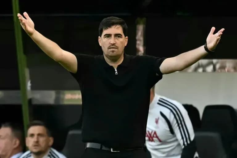 Coach gesturing during a match from the sidelines