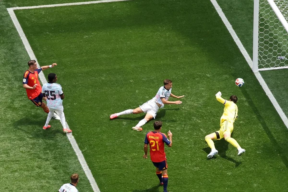 Goalkeeper diving to save a shot on goal