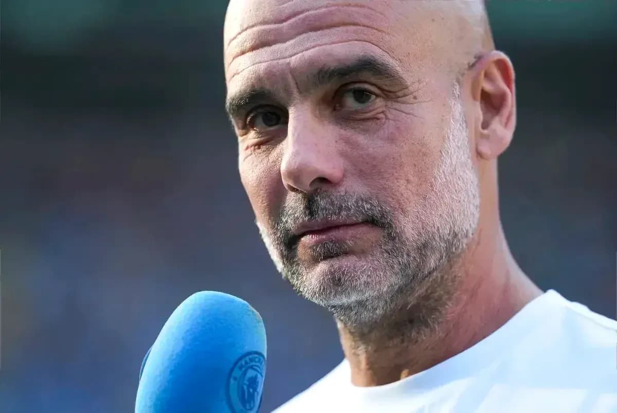Coach speaking into a microphone during interview