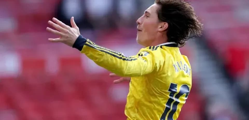 Player celebrating a goal in yellow jersey