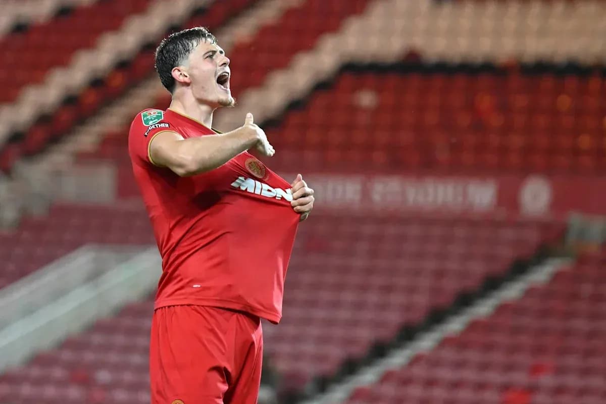 Player celebrating by pulling up jersey after goal