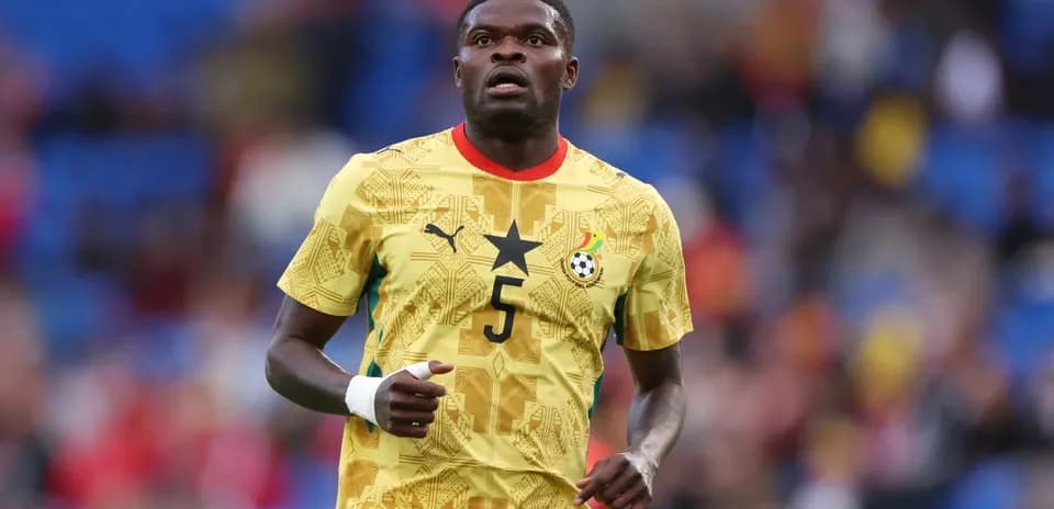 Ghana player wearing yellow jersey during match