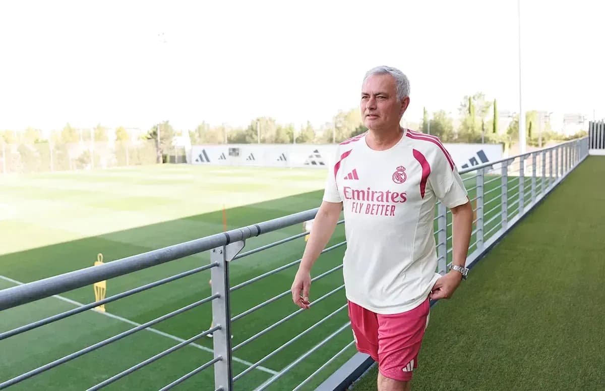 Coach walking near training pitch in Madrid Coach walking near training pitch in Madrid
